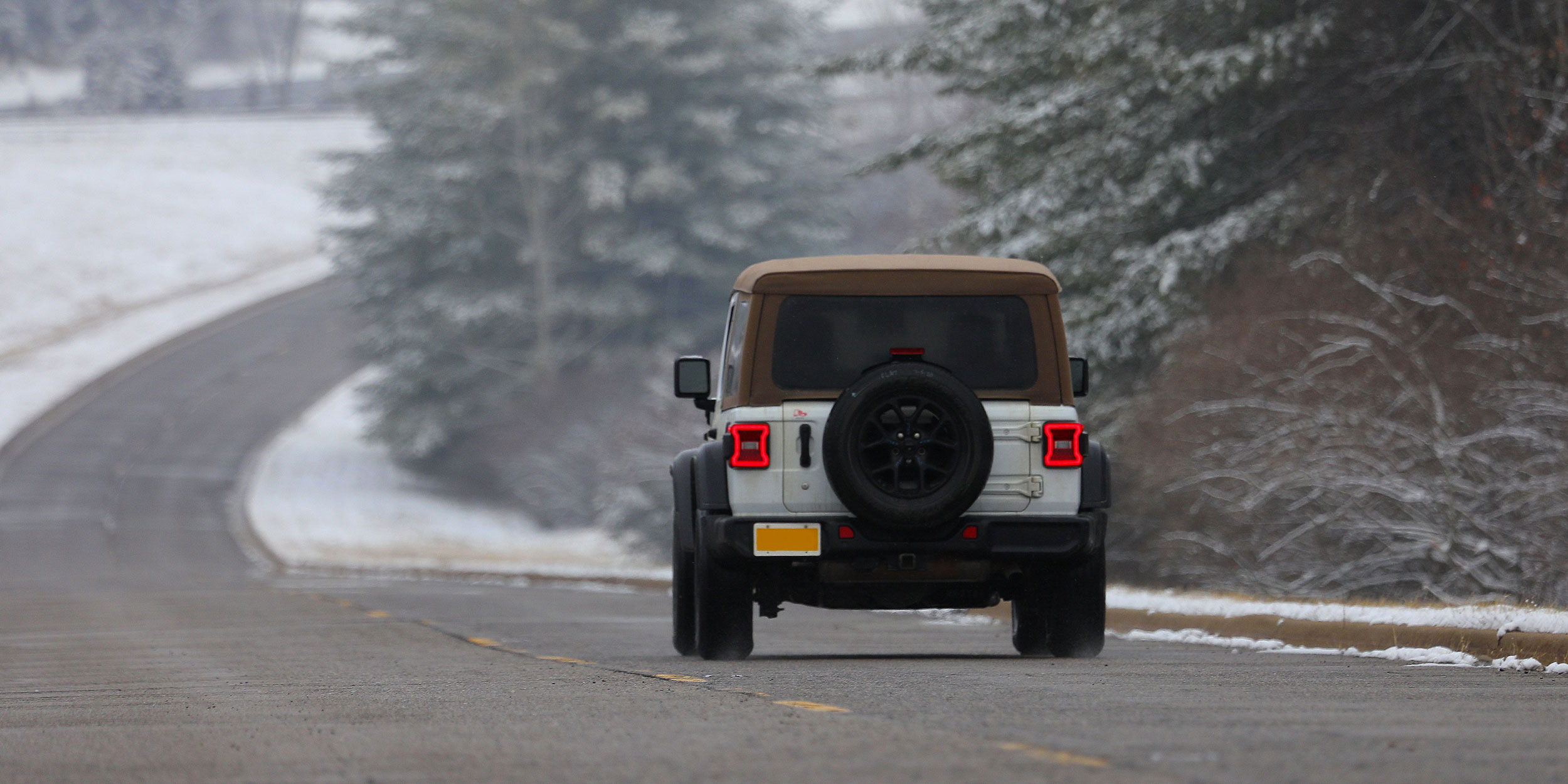 image of car in Grades road with snow